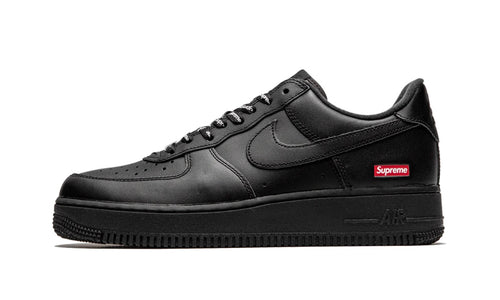 Nike Supreme Air Force 1 Low Black, all-black leather low-top from the side with a small red box logo patch on the heel
