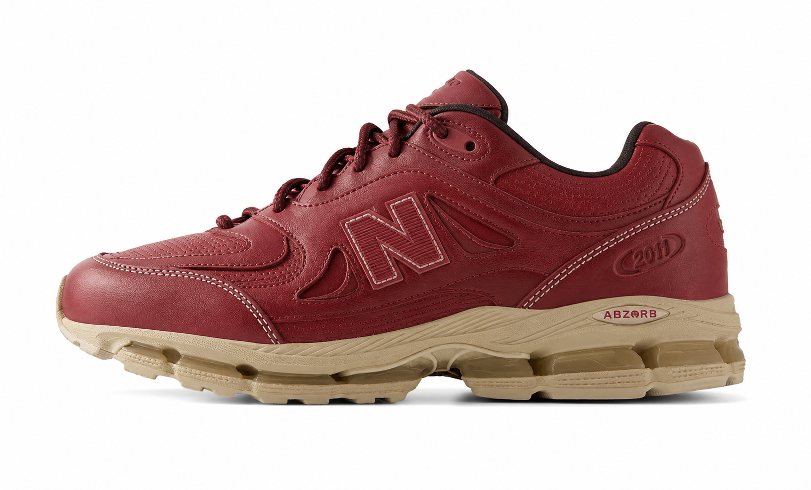 Kith New Balance 2011 Redwood, side view of a burgundy leather runner with tonal N logo and tan ABZORB midsole