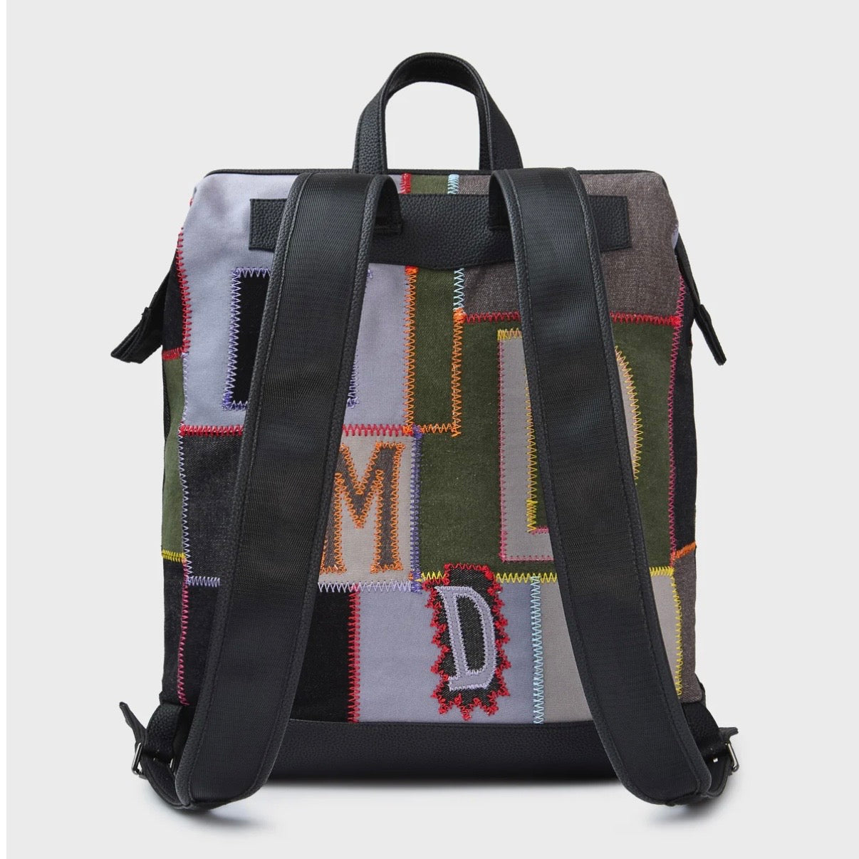 HMDD Hopscotch Box Bag, back view with black padded shoulder straps and top handle over the patchwork panels