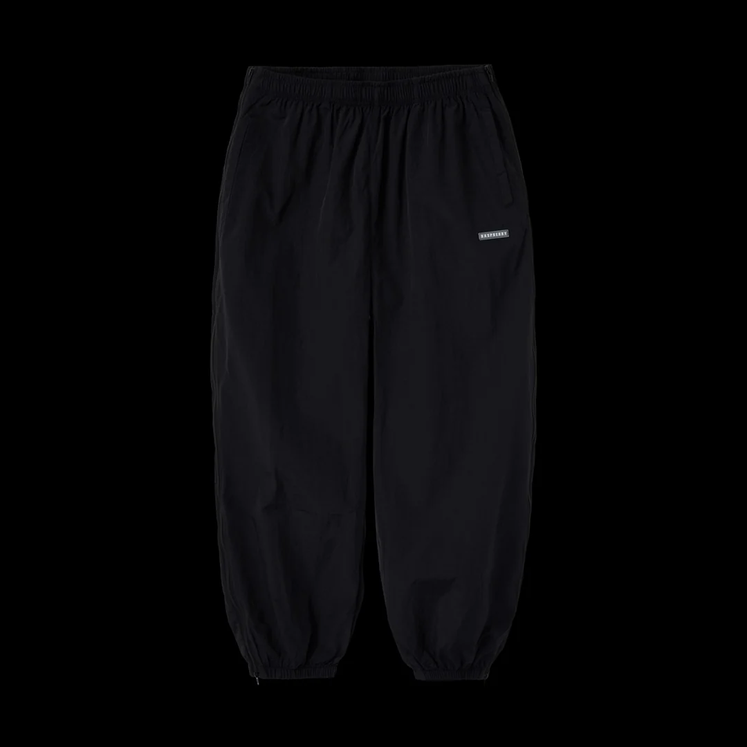 GV Gallery Everyday Sweatpants, black twill pants with elastic cuffs and a grey rubber Raspberry patch on the thigh