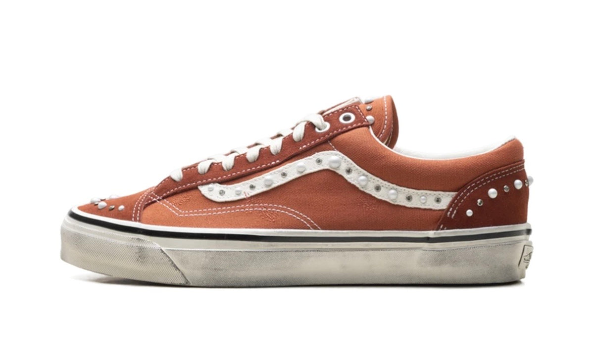 Vans LX Old Skool 36 Pearlized Pack Rust Bronze, lateral side of the rust bronze Old Skool with a cream sidestripe and heel lined with pearl studs on an aged off-white sidewall