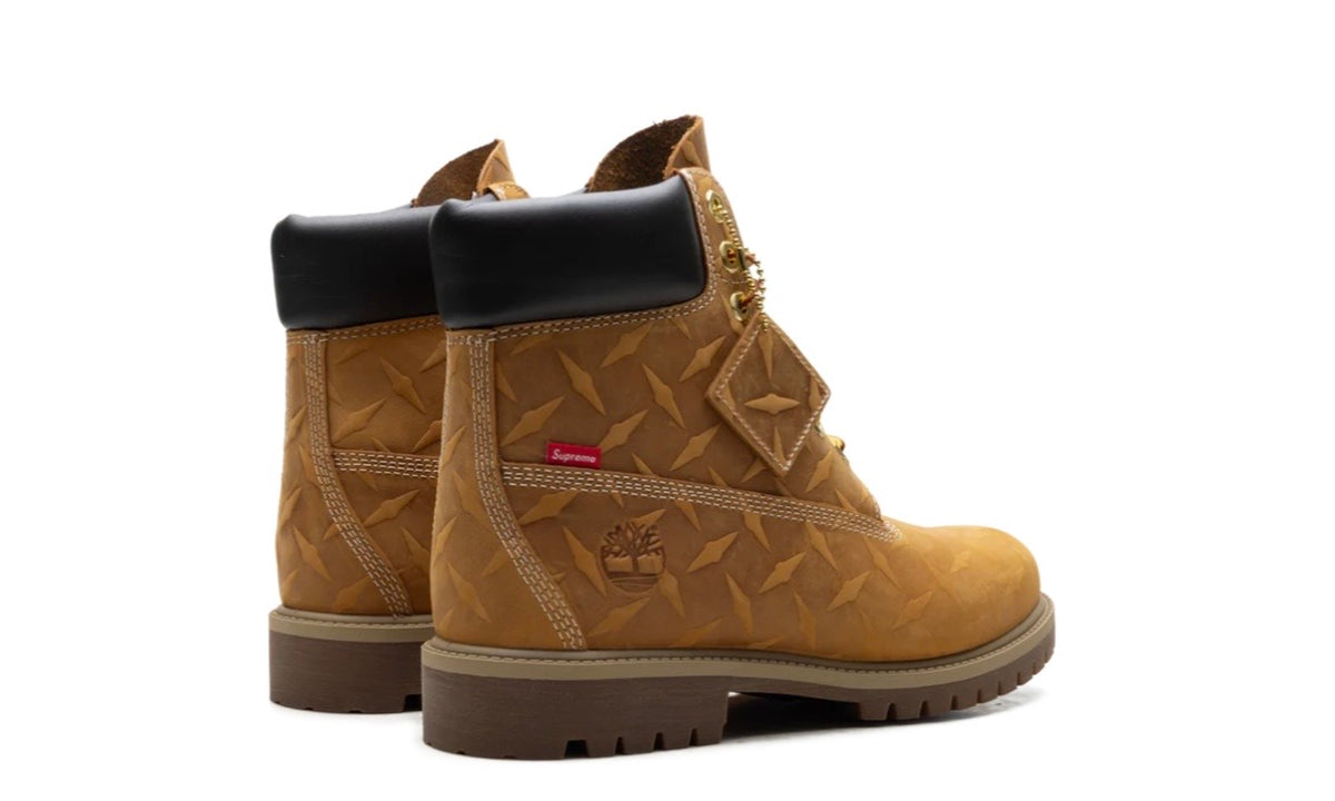 Timberland Supreme Wheat Diamond Plate 6" Boot, rear three-quarter view of the pair with red Supreme heel tabs