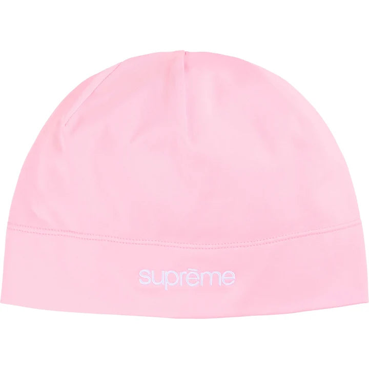 Supreme Base Layer beanie in light pink stretch fabric with a white Supreme logo at the front hem
