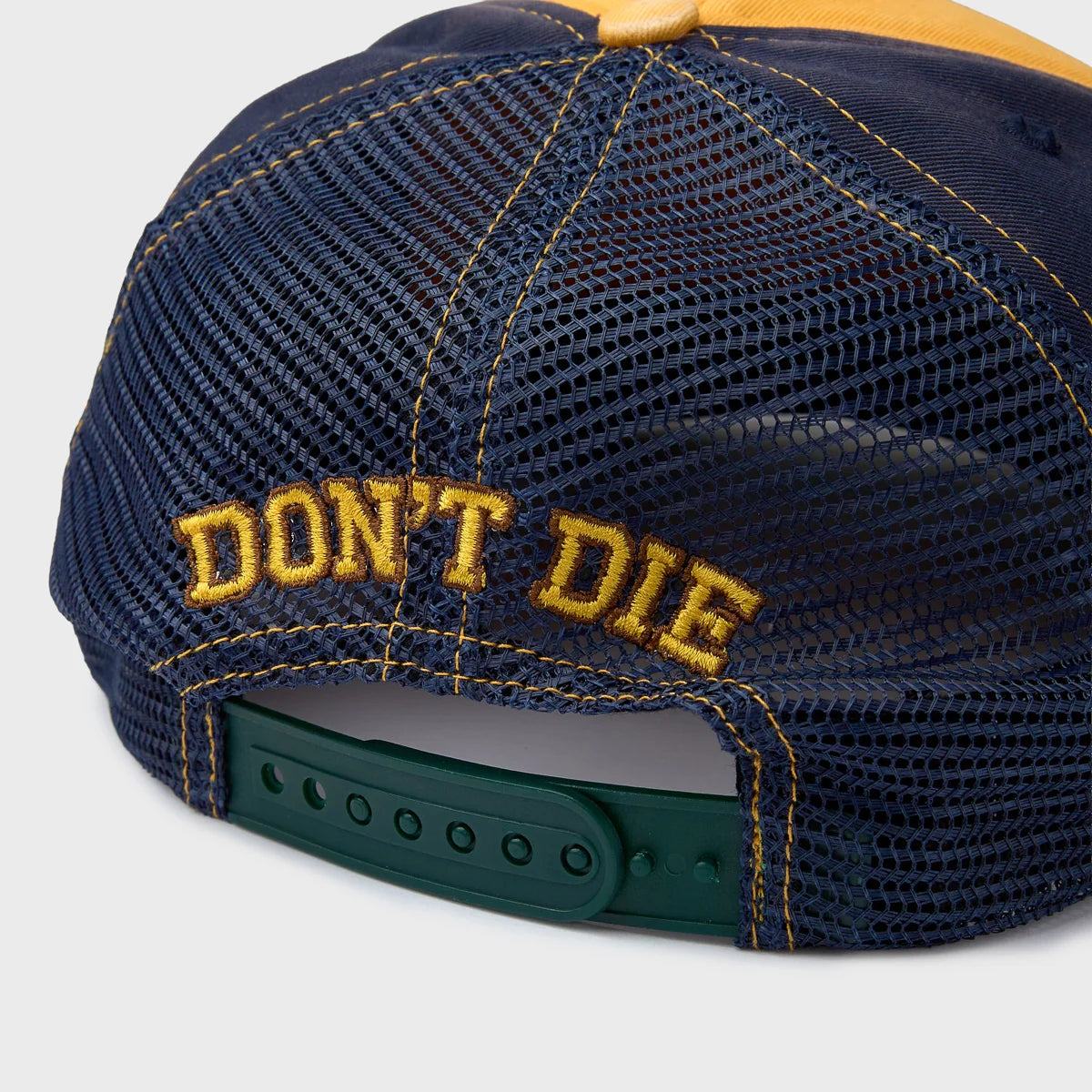 HMDD Yellow Sandlot Hat, back of the navy mesh with yellow Don't Die embroidery and green snapback