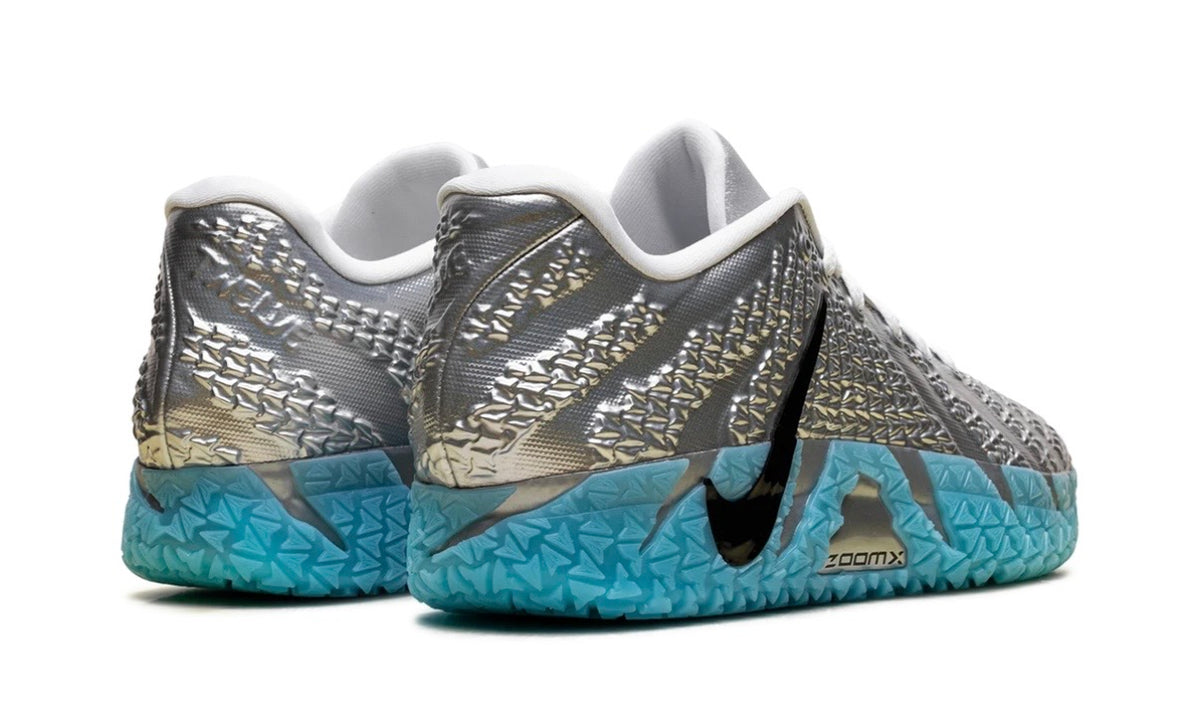 Rear view of silver Nike Ja 3 pair with embossed heels and aqua translucent soles