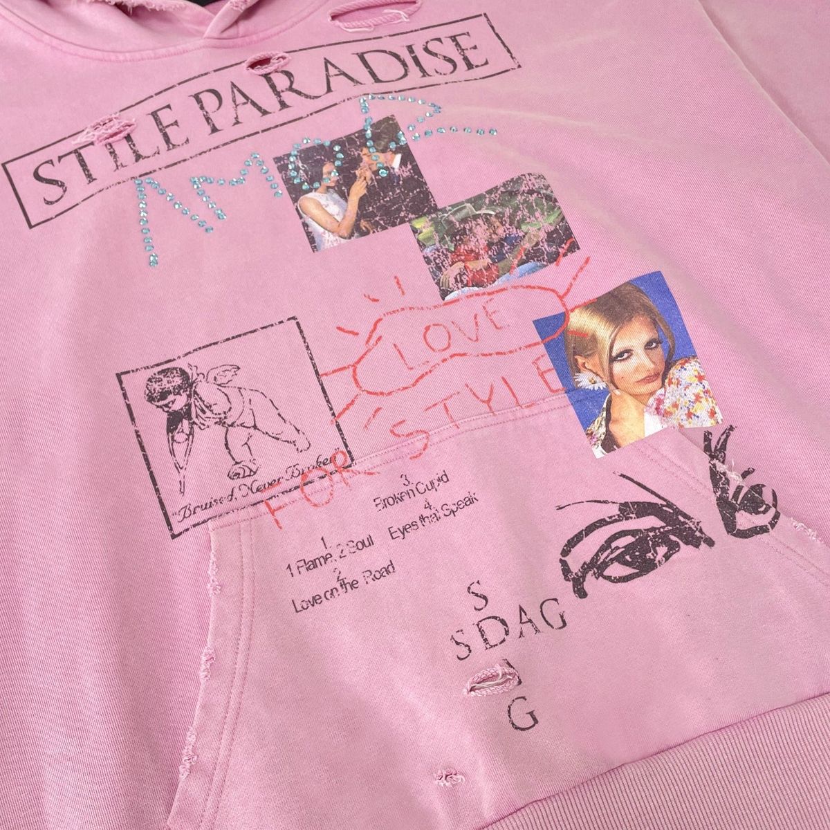 Close-up of the Stile Paradise hoodie front collage with photo prints, line drawings and rhinestone lettering