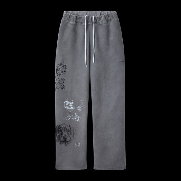 Washed grey wide-leg sweatpants with sketch-style dog artwork printed on one leg
