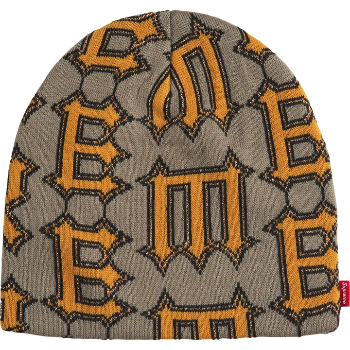 Other side of the grey Supreme Spike beanie with orange spiked letter knit