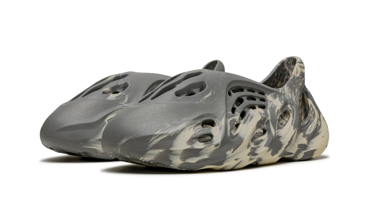 Adidas Yeezy Foam Runner MXT Moon Gray, medial side view showing the grey-dominant swirl and vent cutouts