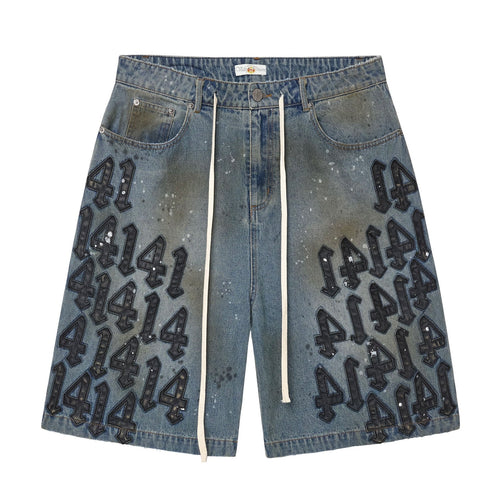 Vale Black Charm Jorts, baggy blue denim jorts with black puffy 414 graffiti prints and a drawcord at the waist