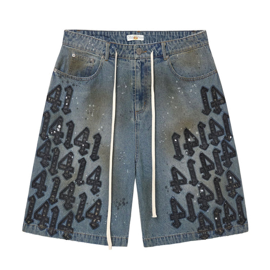 Vale Black Charm Jorts, baggy blue denim jorts with black puffy 414 graffiti prints and a drawcord at the waist