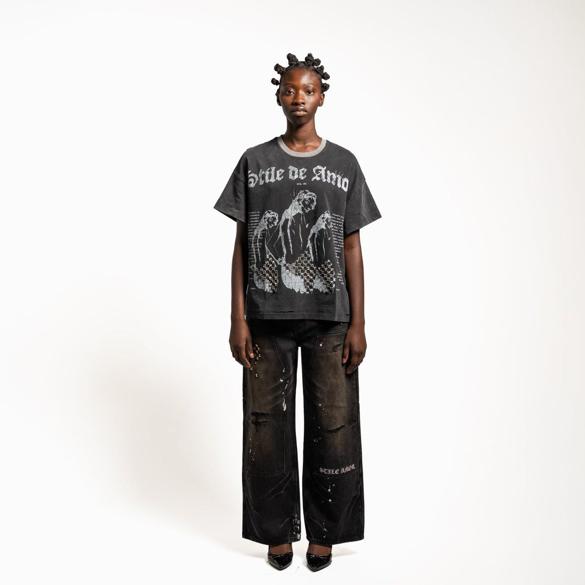 Model wearing the Stile De Amor 1950 Splatter denim pants with a graphic tee, front view