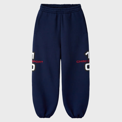 HMDD navy sweatpants with red and white 10 CHIM SPORT prints on the outer legs and elastic cuffs, front view