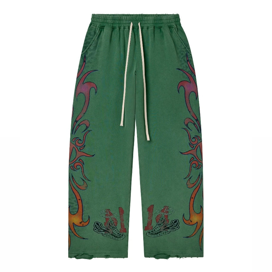 Vale Green Inferno Sweatpants front view in green with red tribal flame graphics up both legs