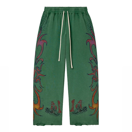 Vale Green Inferno Sweatpants front view in green with red tribal flame graphics up both legs