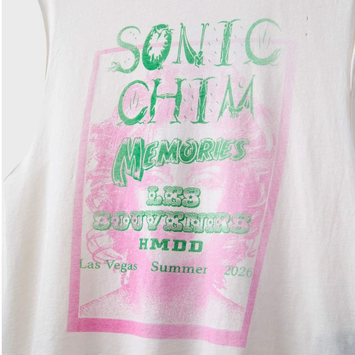 HMDD Vegas Cutoff, close-up of the front print, green SONIC CHIM lettering on a pink frame with Las Vegas Summer text