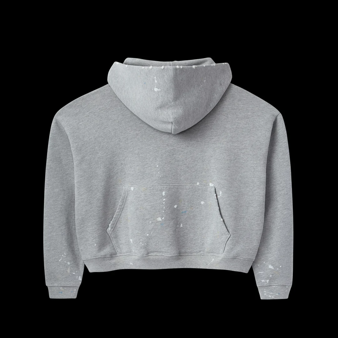 Back of the heather grey hoodie with a rear kangaroo pocket and paint splatters