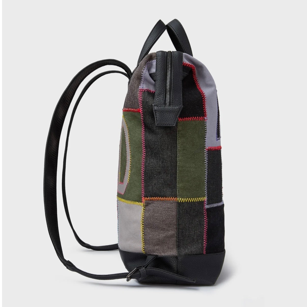 HMDD Hopscotch Box Bag, side view showing the boxy patchwork body, black shoulder straps and leather base