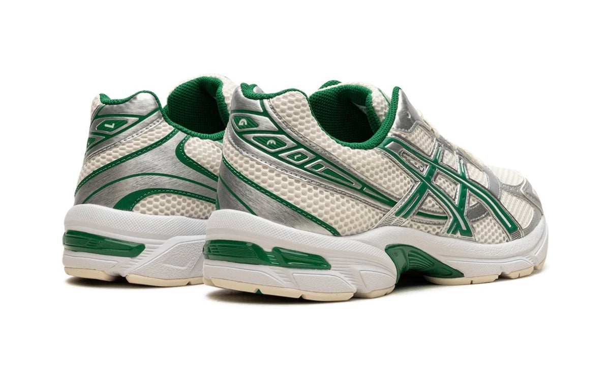 Asics Gel-1130 Cream Kale, rear three-quarter view of the pair showing the green heel tab and GEL window