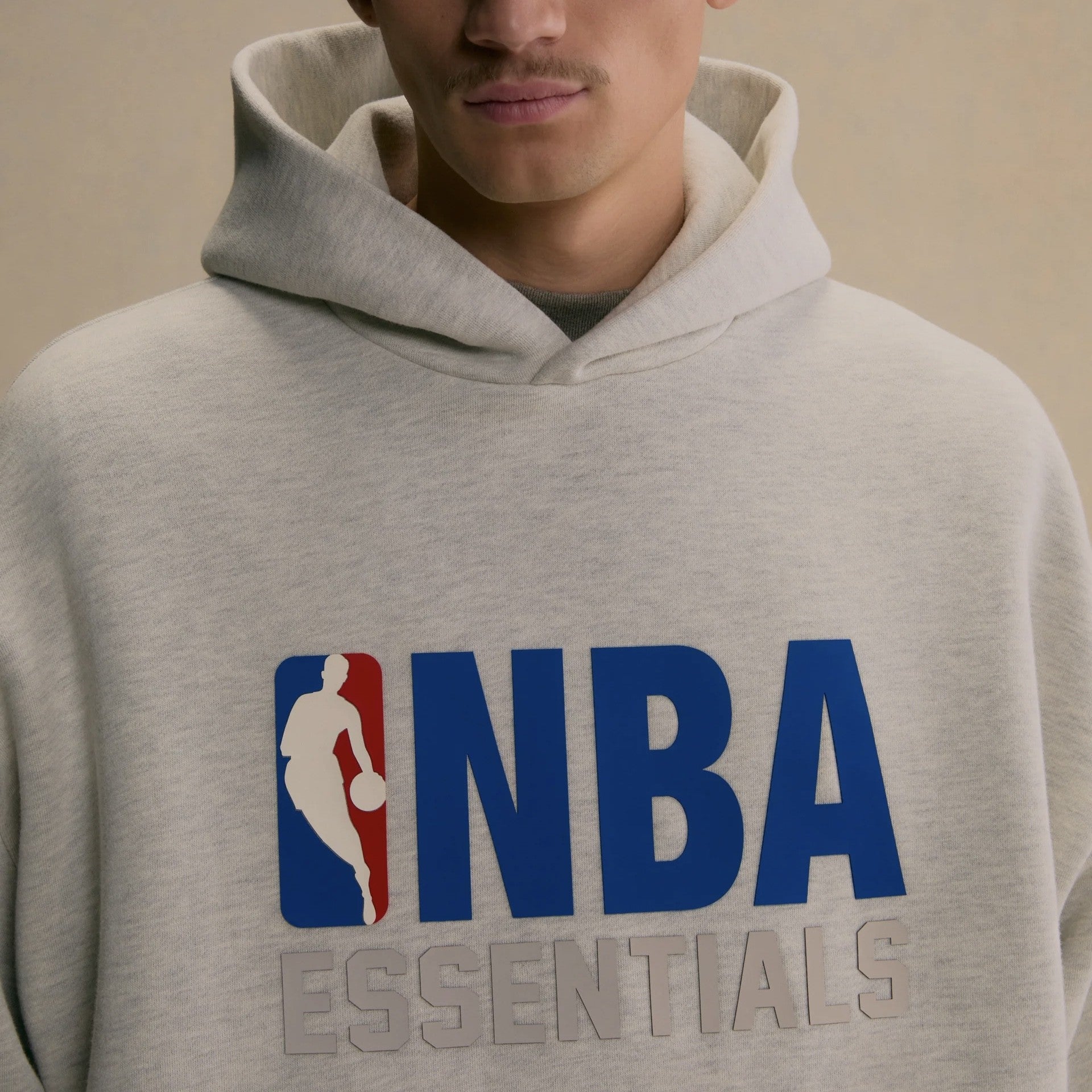 Fear of God Essentials NBA Light Heather Hoodie On Body