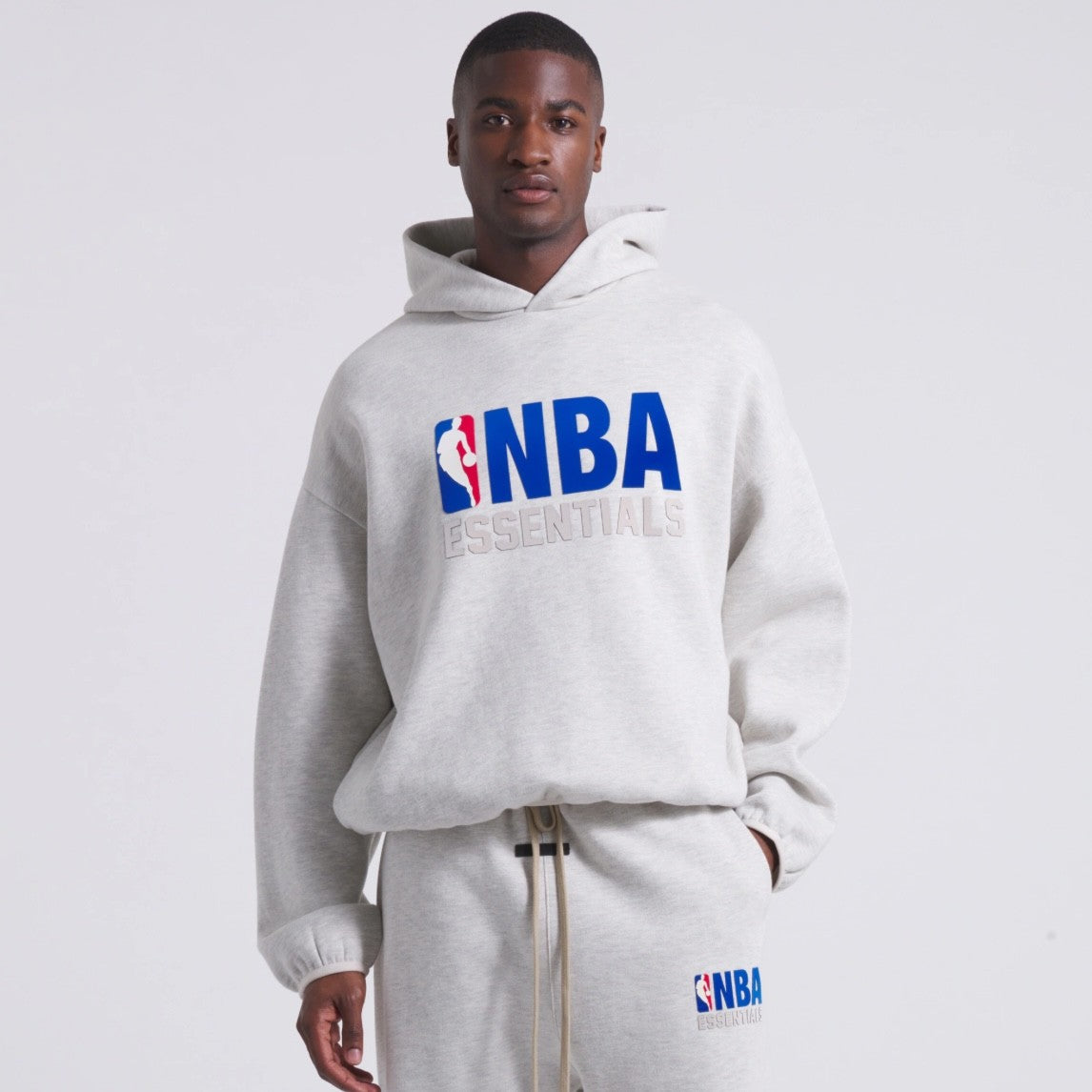 Fear of God Essentials NBA Light Heather Hoodie On Body Front