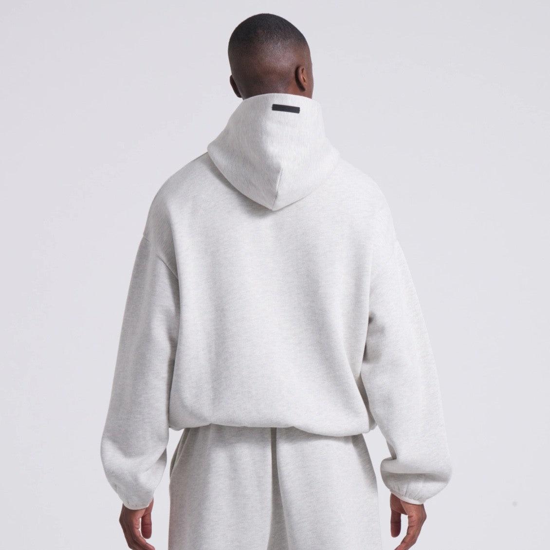 Fear of God Essentials NBA Light Heather Hoodie On Body Back