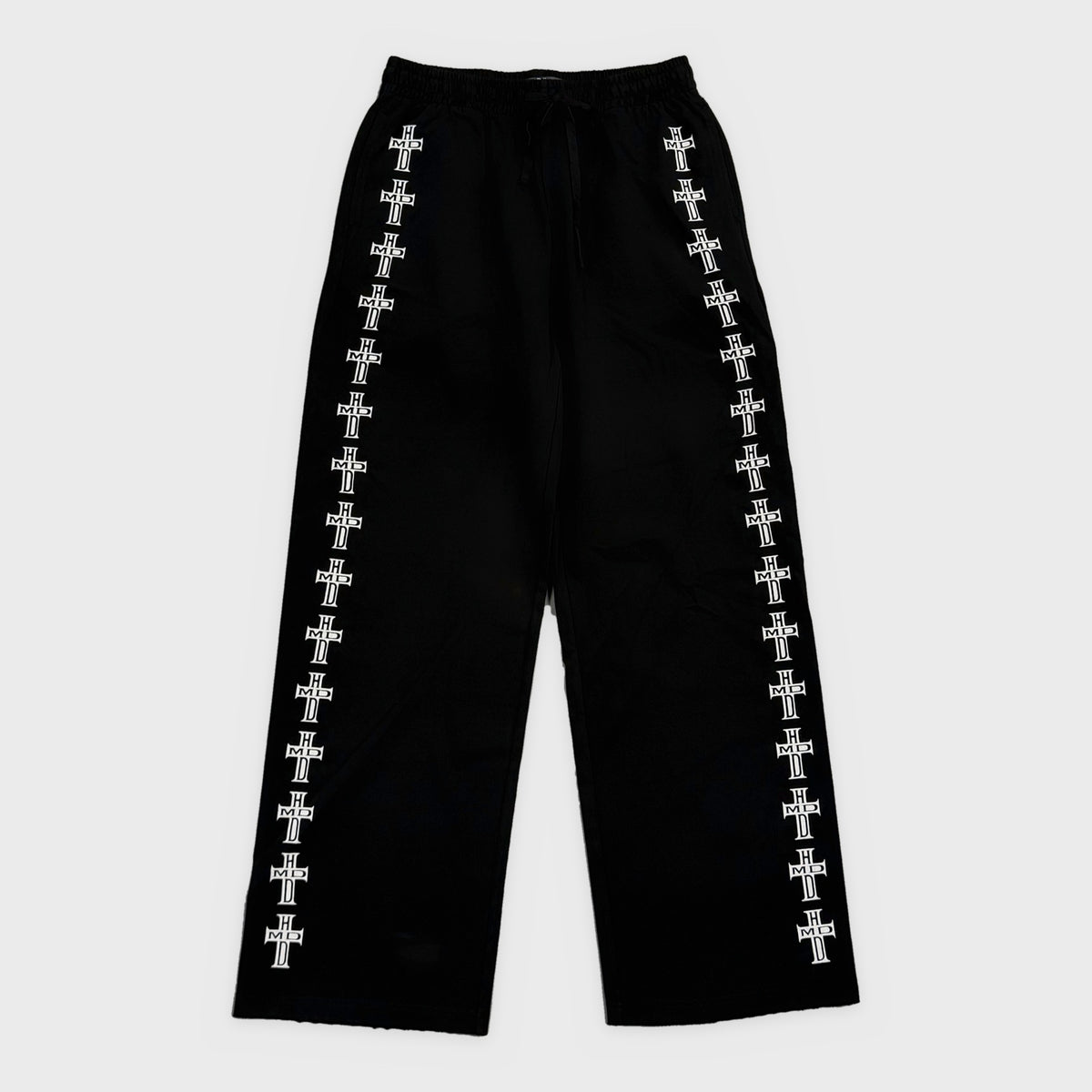HMDD Black Holy Cross Sweatpants, black wide-leg sweatpants with a column of white HMDD cross prints down each leg