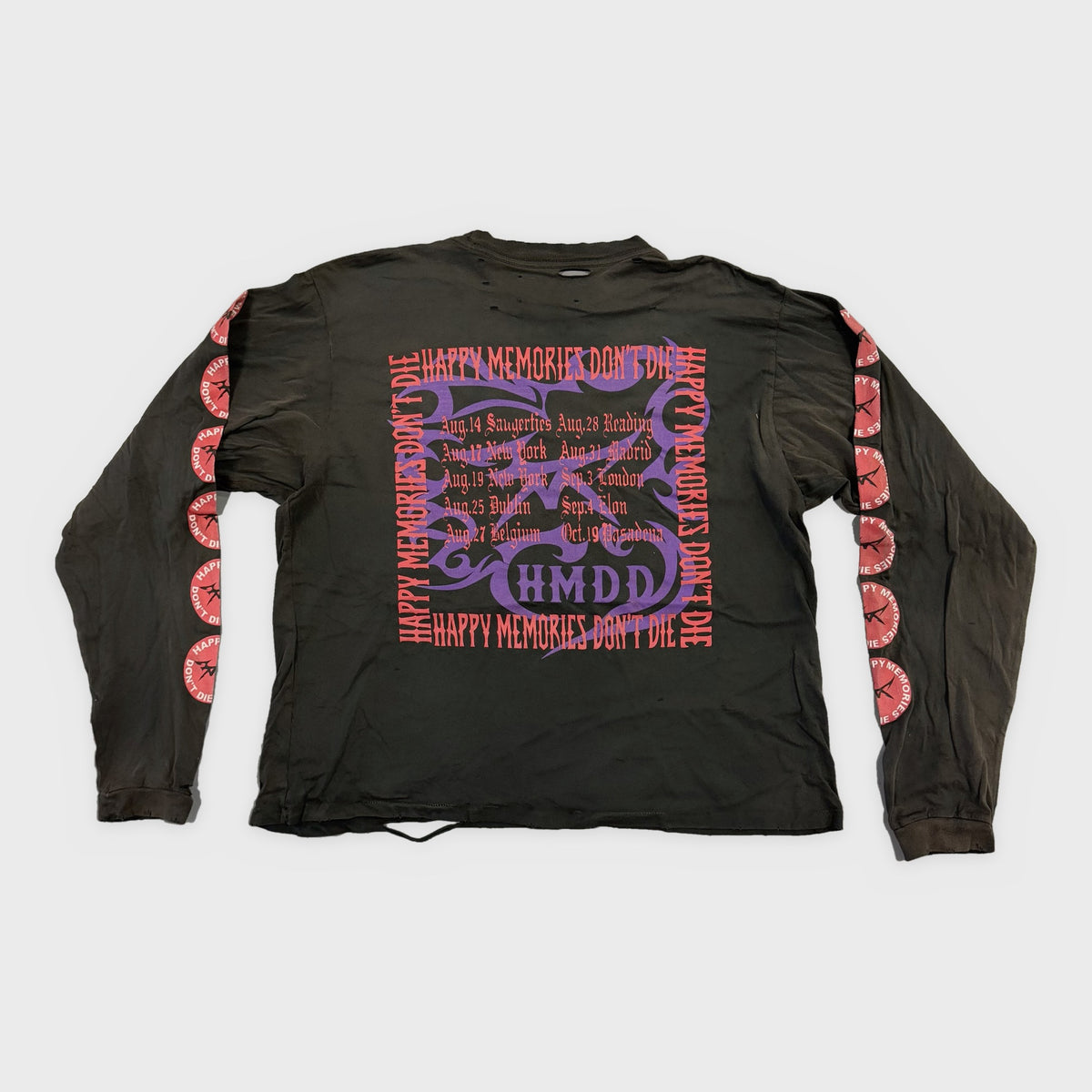 HMDD Black Smiley Long Sleeve, back with a purple HMDD crest framed by red Happy Memories Don't Die text