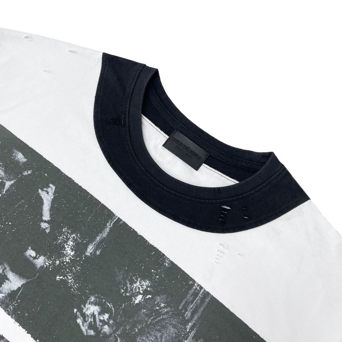 Close-up of the black ribbed collar and small distress marks on the Biocolore V2 Long Sleeve