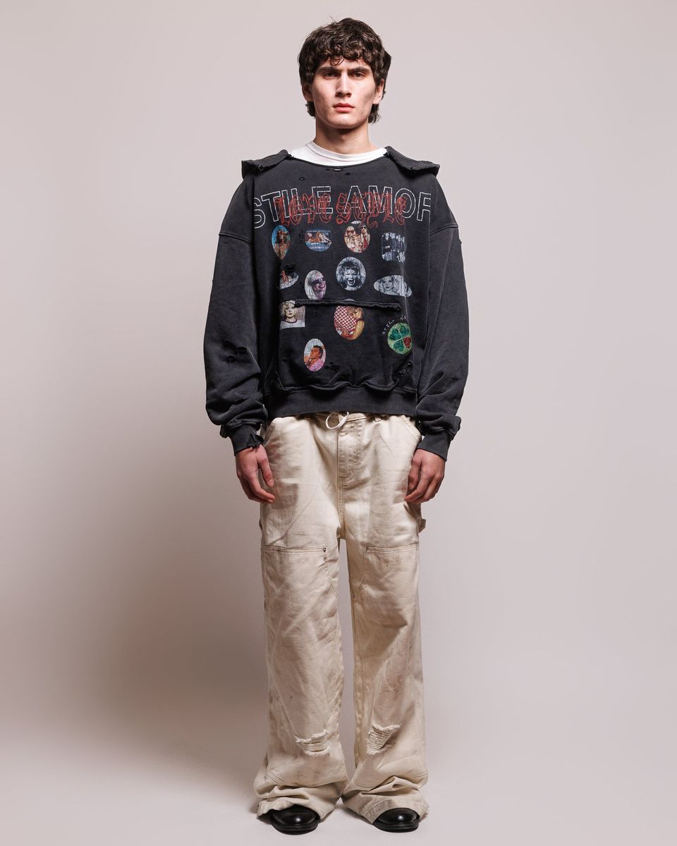 Model wearing the Stile De Amor Sfera Hoodie with cream trousers