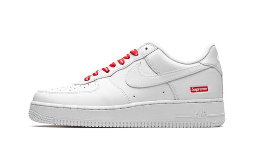 Nike Supreme Air Force 1 Low White, all-white leather low-top with red laces and a red box logo patch on the heel