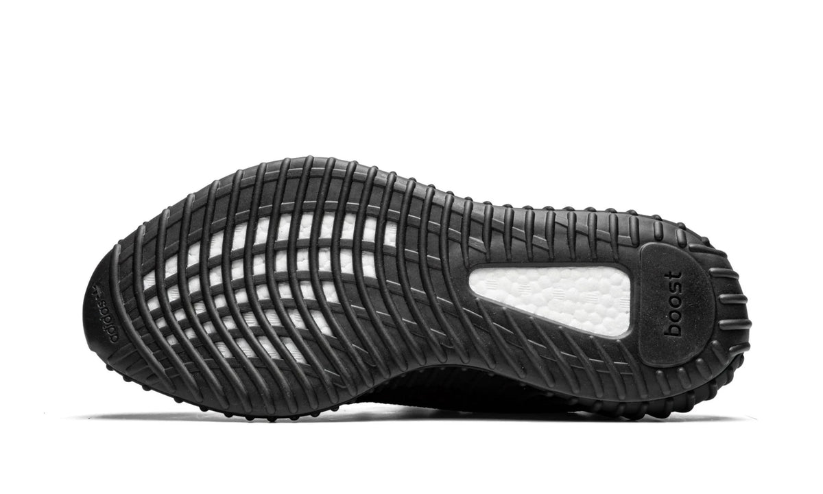 Yeezy 350 V2 Black Red, outsole view with the translucent black cage over a white Boost midsole.