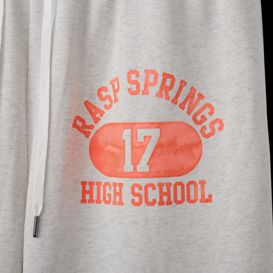 Close-up of the orange Rasp Springs 17 High School print on the Spring Sweatpants