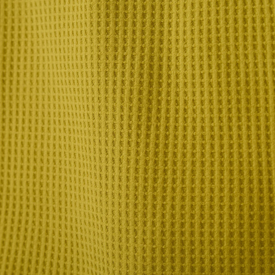 Close-up of the mustard waffle-knit texture on the GV Gallery Training Quarter Zip